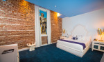 The Gabriel Suite features a king bedroom, exposed brick walls and Egyptian white linens.